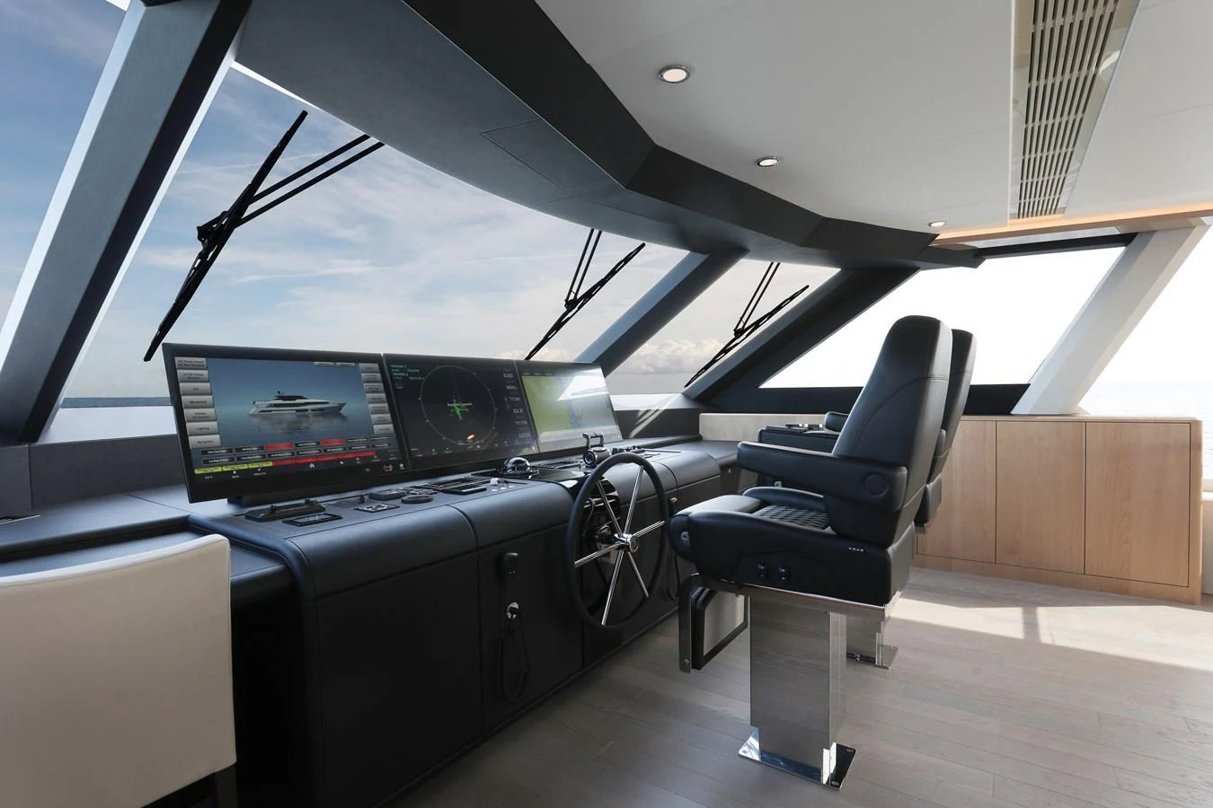 The helm station offers a sleek and modern command center with panoramic views. aboard OCEAN ALEXANDER 28L Yacht for Sale