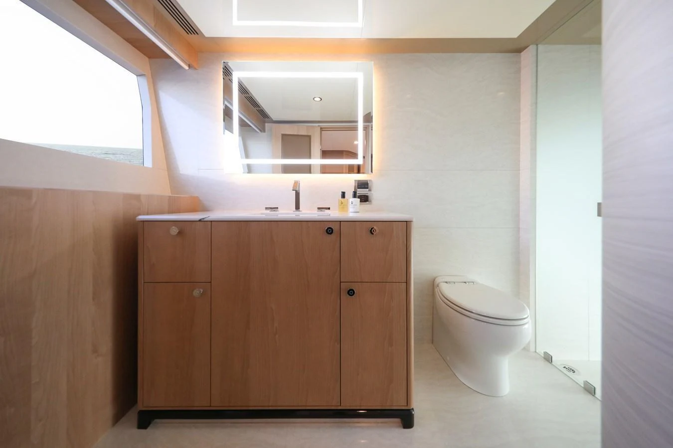 The yacht's bathroom features modern fixtures and a sleek design with ample natural light. aboard OCEAN ALEXANDER 28L Yacht for Sale