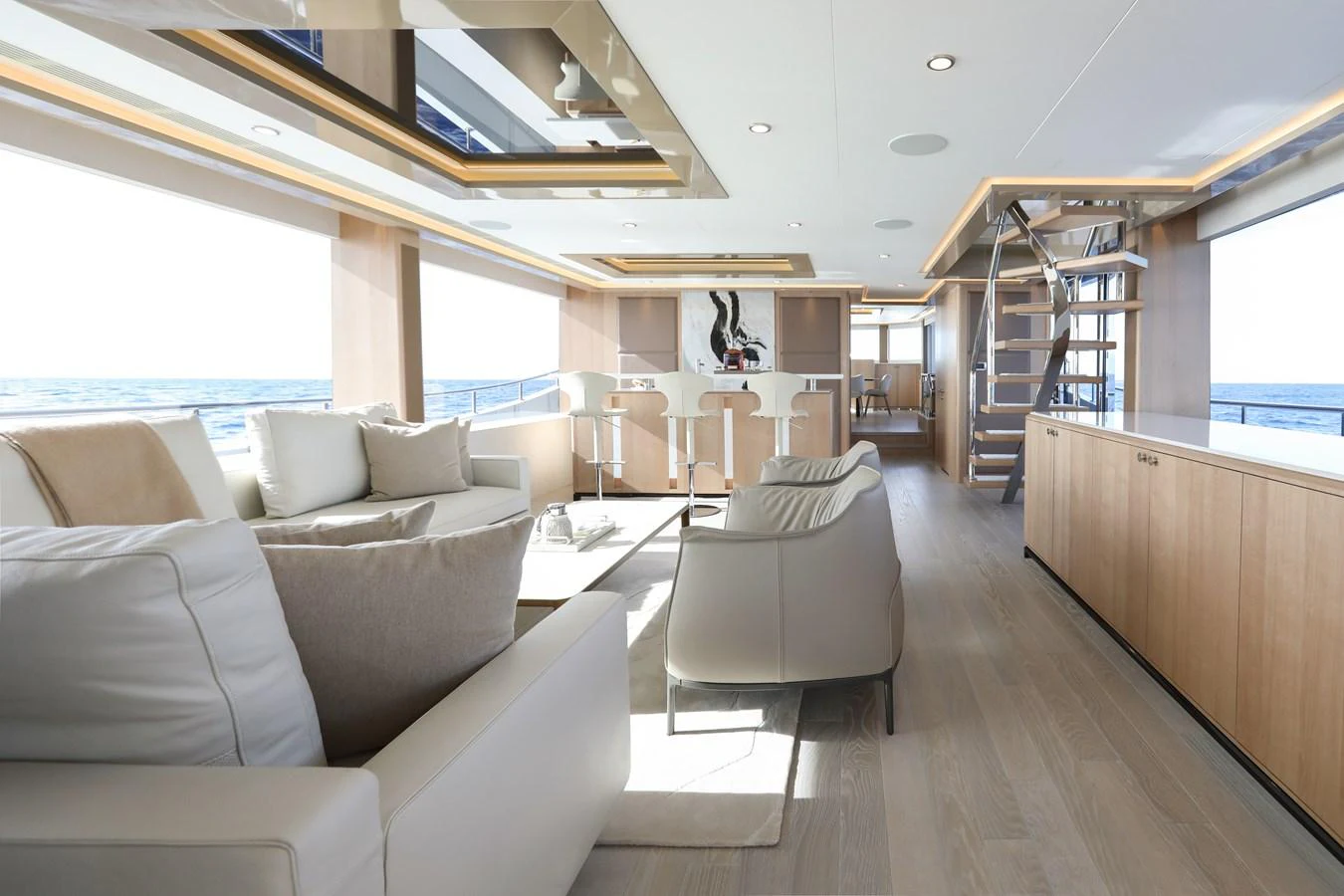 The salon features a spacious and modern design with ample natural light and elegant furnishings. aboard OCEAN ALEXANDER 28L Yacht for Sale
