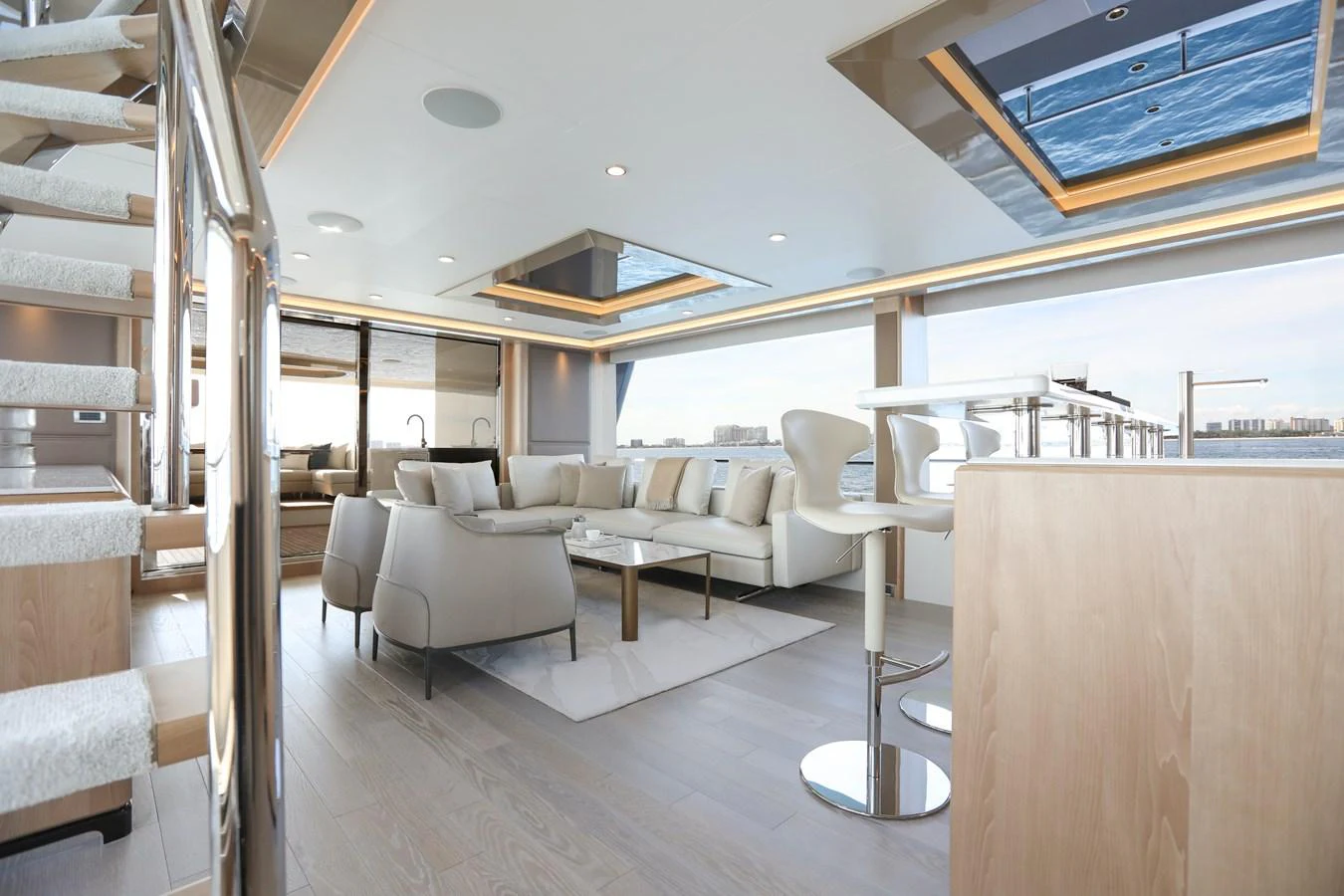 The salon features a spacious and modern design with ample natural light and luxurious furnishings. aboard OCEAN ALEXANDER 28L Yacht for Sale