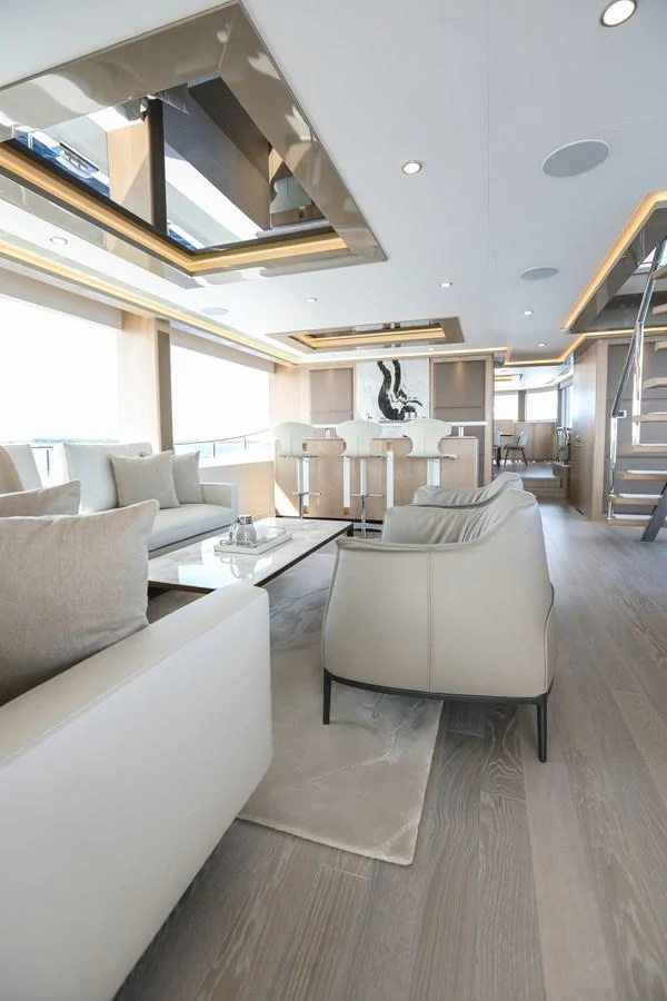 The salon features modern furnishings and ample natural light, creating an inviting and luxurious atmosphere. aboard OCEAN ALEXANDER 28L Yacht for Sale