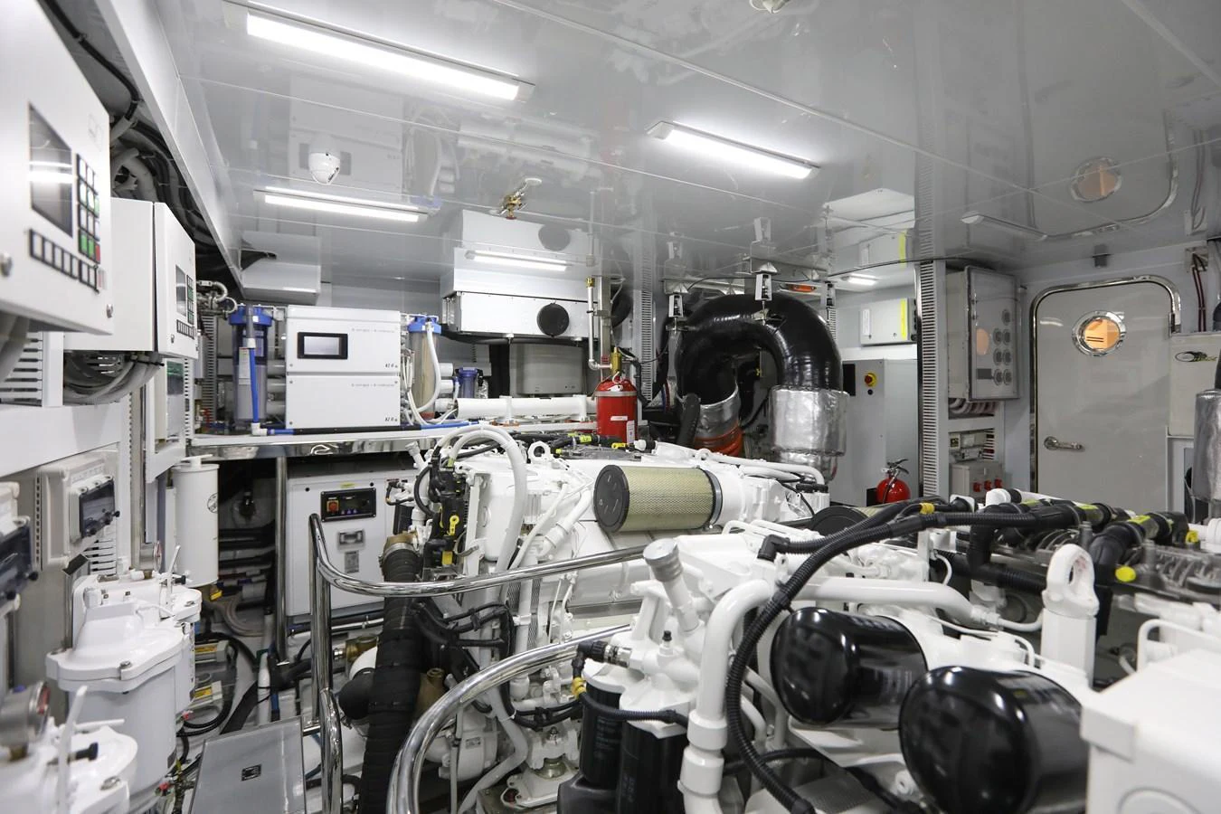 The yacht's engine room showcases advanced machinery and well-organized systems. aboard OCEAN ALEXANDER 28L Yacht for Sale
