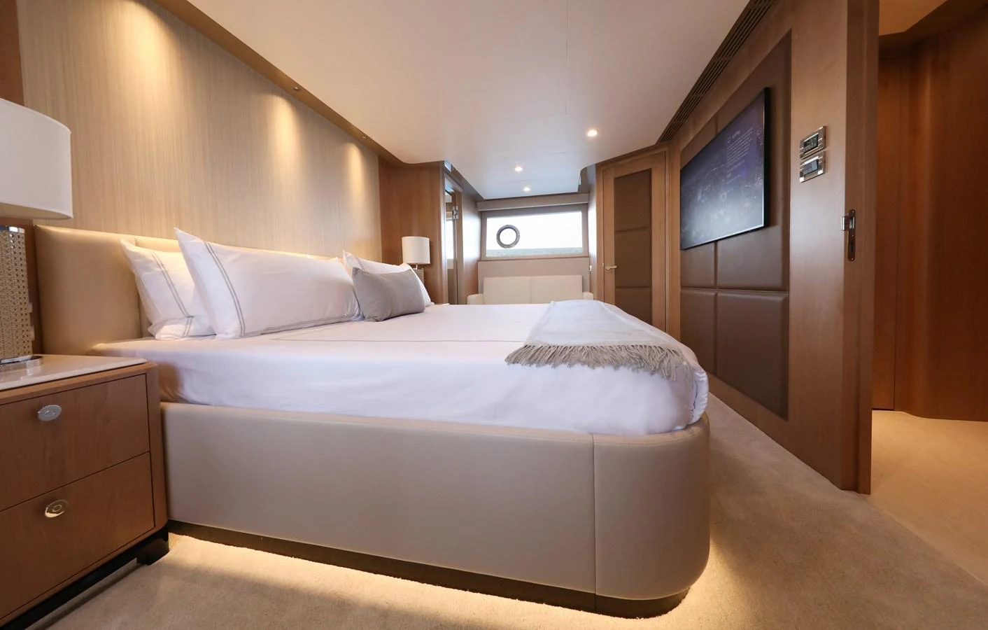 The master stateroom offers a luxurious and spacious retreat with elegant wood finishes and modern amenities. aboard OCEAN ALEXANDER 28L Yacht for Sale