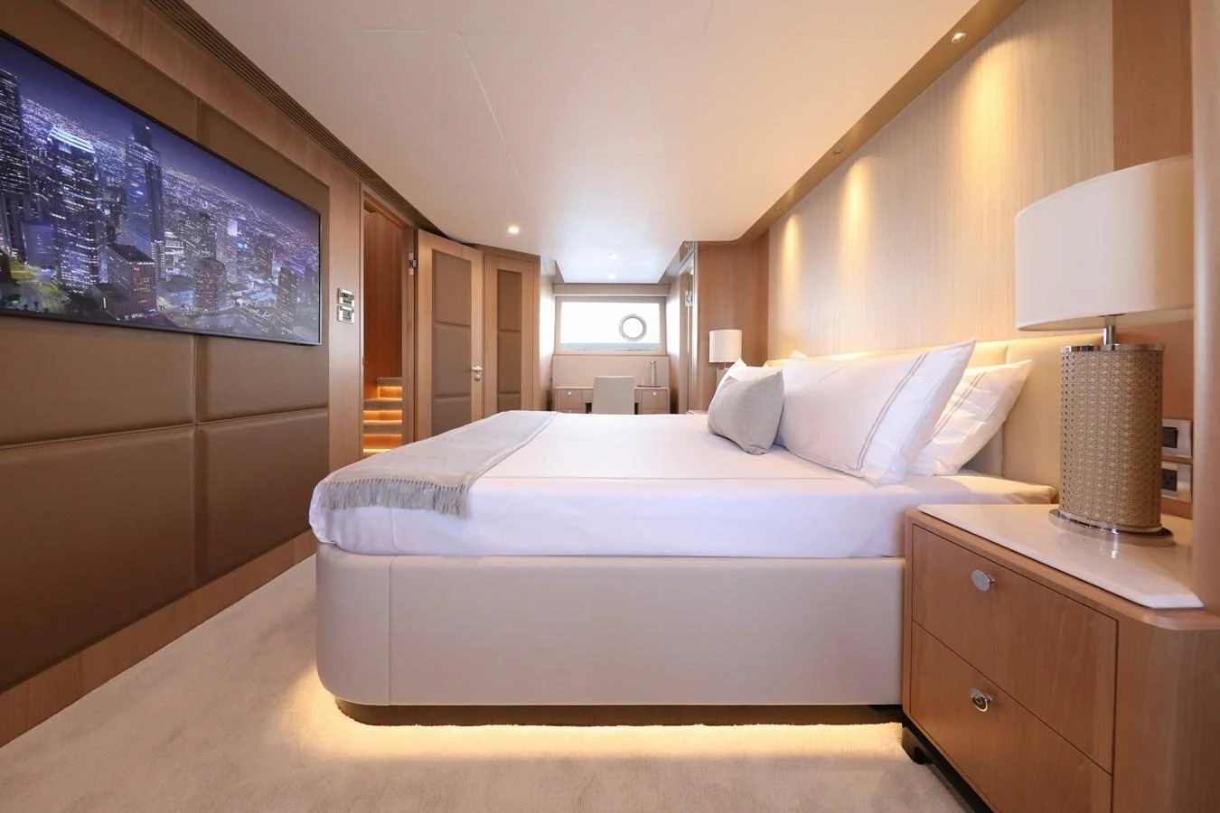 A luxurious stateroom featuring a large bed, modern decor, and ambient lighting. aboard OCEAN ALEXANDER 28L Yacht for Sale