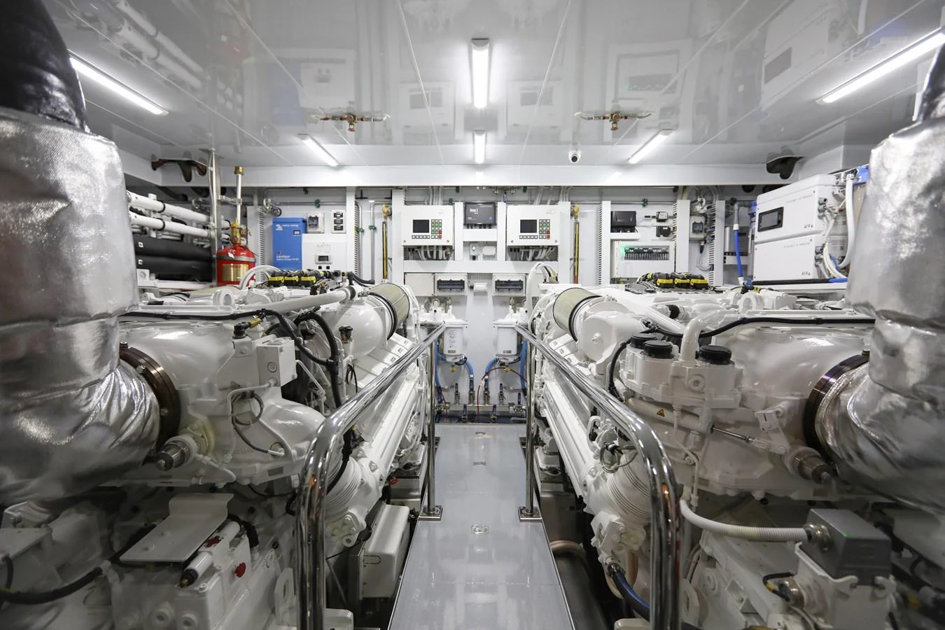 The image showcases a pristine and well-organized engine room with advanced machinery. aboard OCEAN ALEXANDER 28L Yacht for Sale