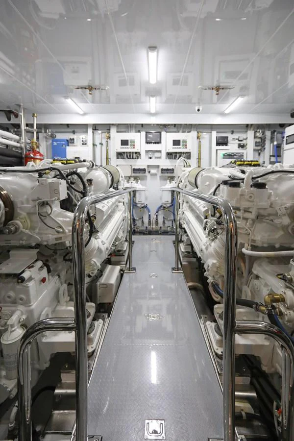 The image showcases the meticulously organized engine room of the yacht, highlighting its advanced machinery and clean layout. aboard OCEAN ALEXANDER 28L Yacht for Sale