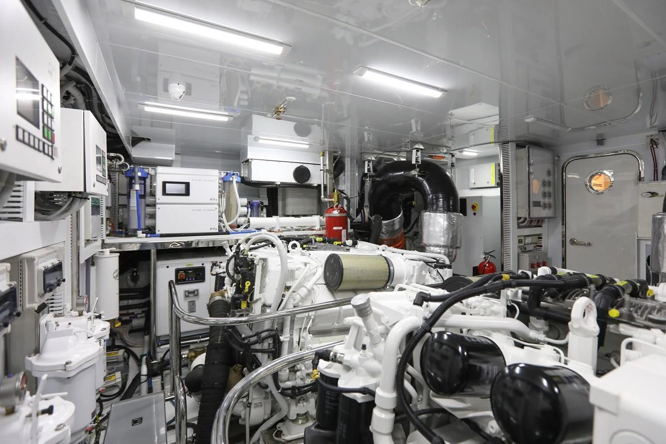 The engine room is equipped with advanced machinery and systems, showcasing the yacht's engineering excellence. aboard OCEAN ALEXANDER 28L Yacht for Sale