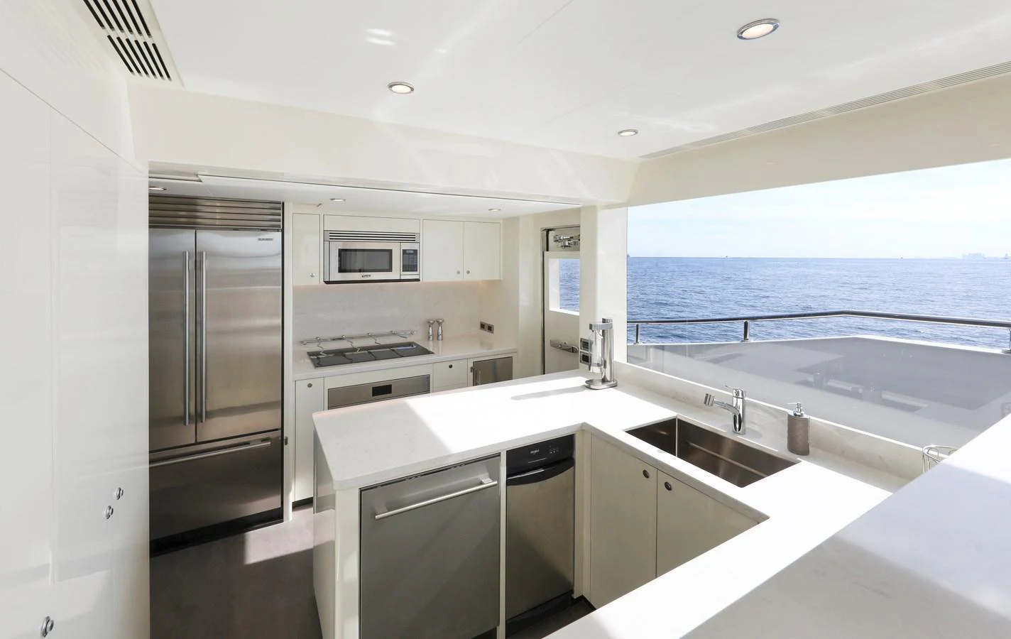 The yacht's galley features modern appliances and a spacious layout with a stunning ocean view. aboard OCEAN ALEXANDER 28L Yacht for Sale