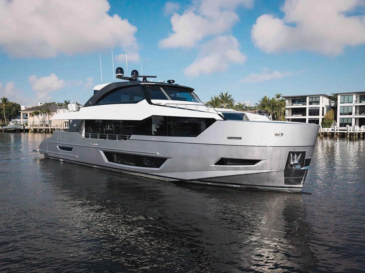 A sleek and modern yacht glides gracefully on calm waters, showcasing its contemporary design and luxurious features. aboard CHAOS Yacht for Sale
