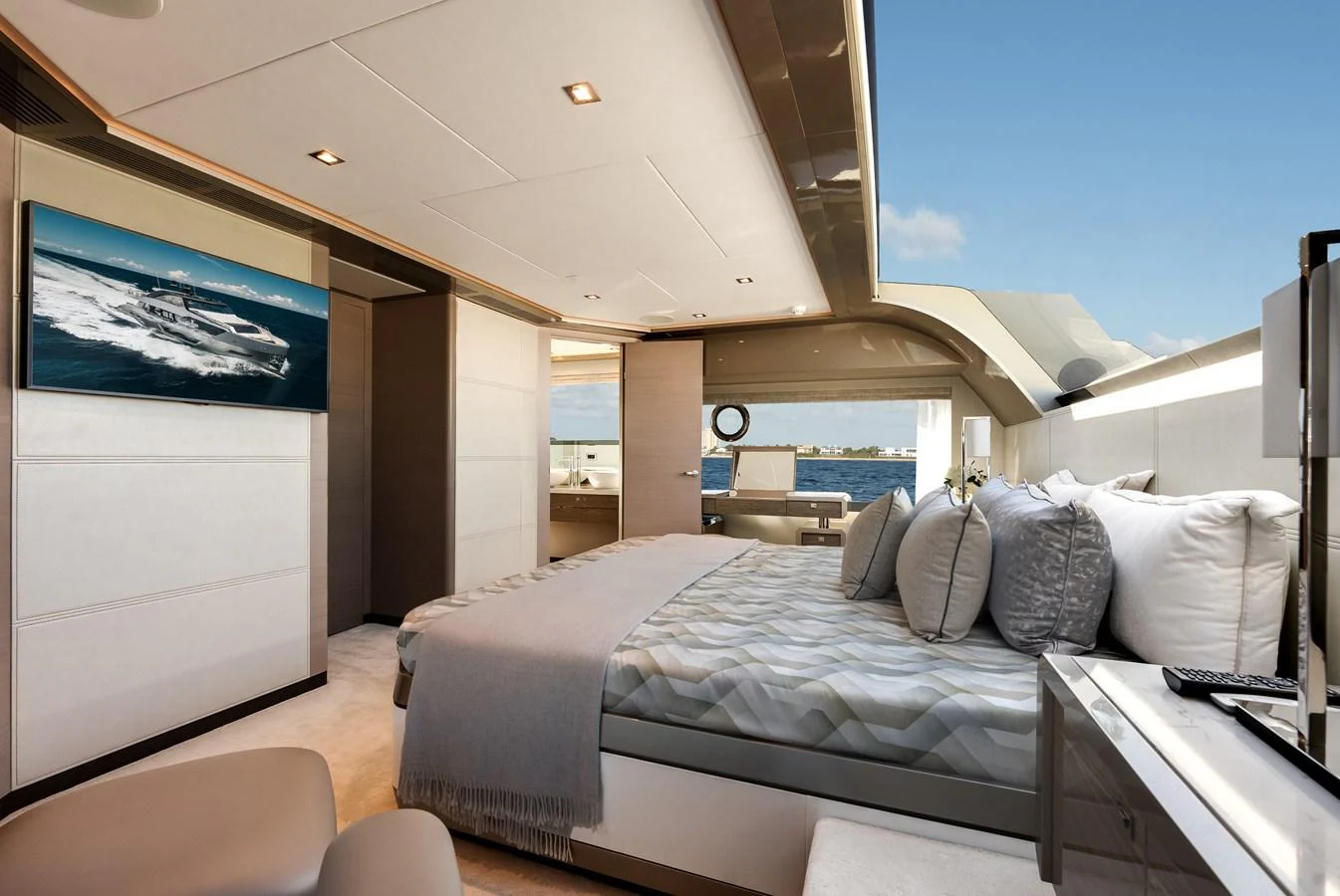 The master stateroom offers a luxurious and spacious retreat with a stunning view of the sea. aboard CHAOS Yacht for Sale