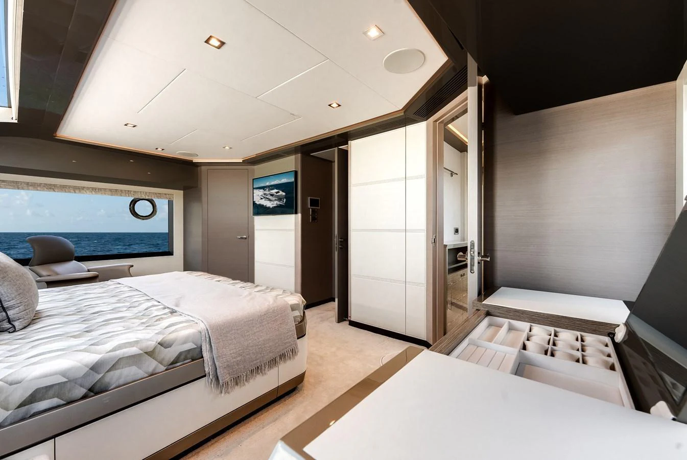The stateroom offers a luxurious and serene retreat with a large bed and elegant decor. aboard CHAOS Yacht for Sale