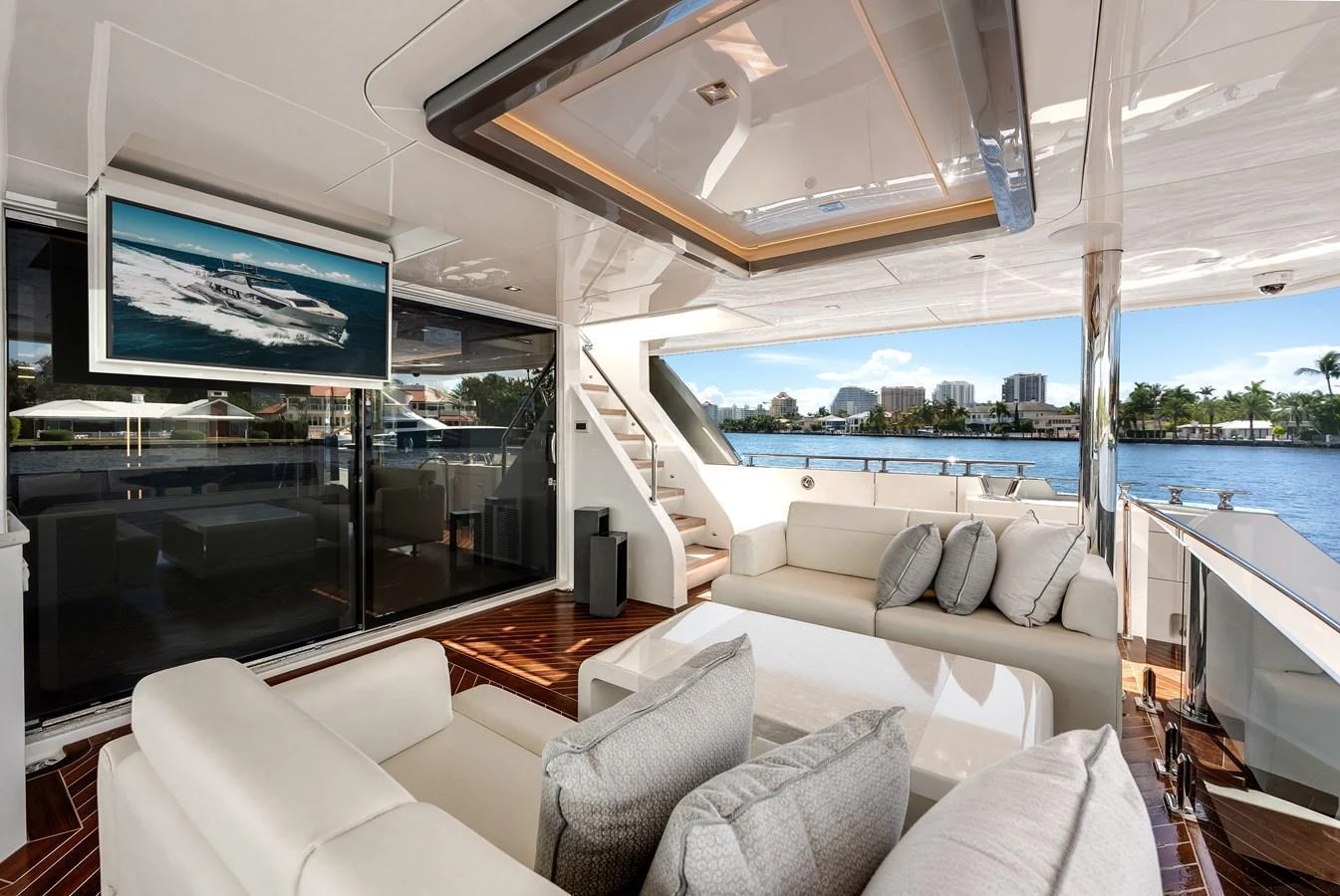 The salon offers a luxurious and comfortable seating area with a view of the water. aboard CHAOS Yacht for Sale