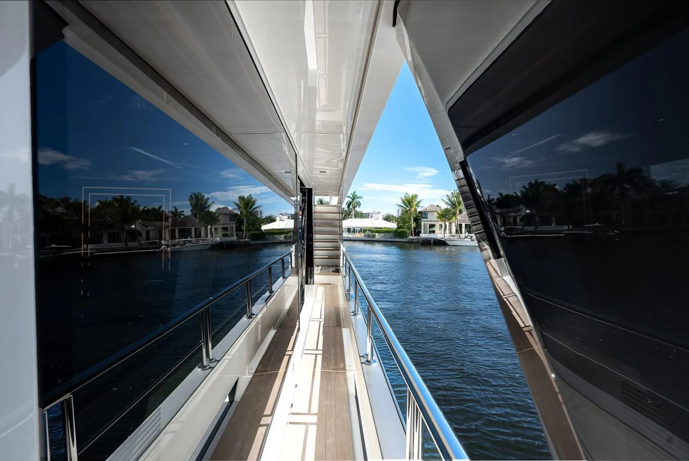 The sleek side deck offers a seamless connection to the water and surrounding views. aboard CHAOS Yacht for Sale