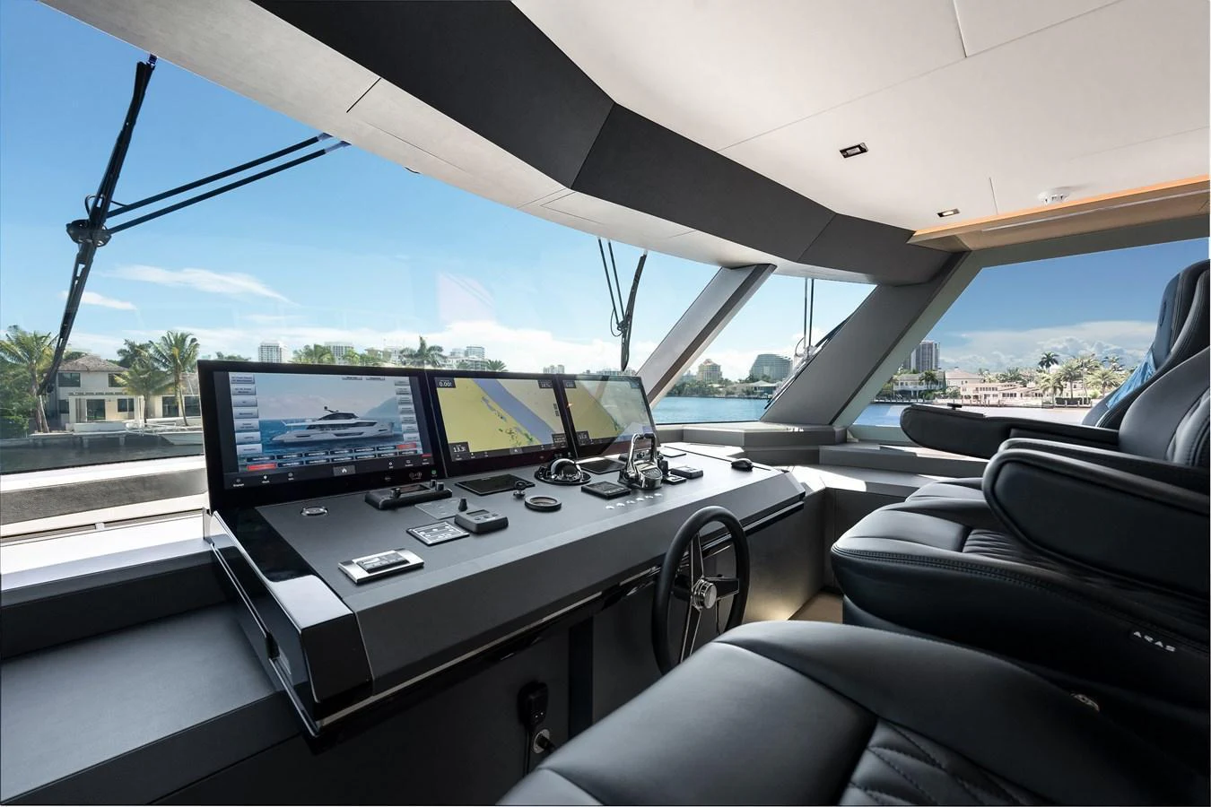 The helm station offers a sleek and modern design with advanced navigation equipment and luxurious seating. aboard CHAOS Yacht for Sale