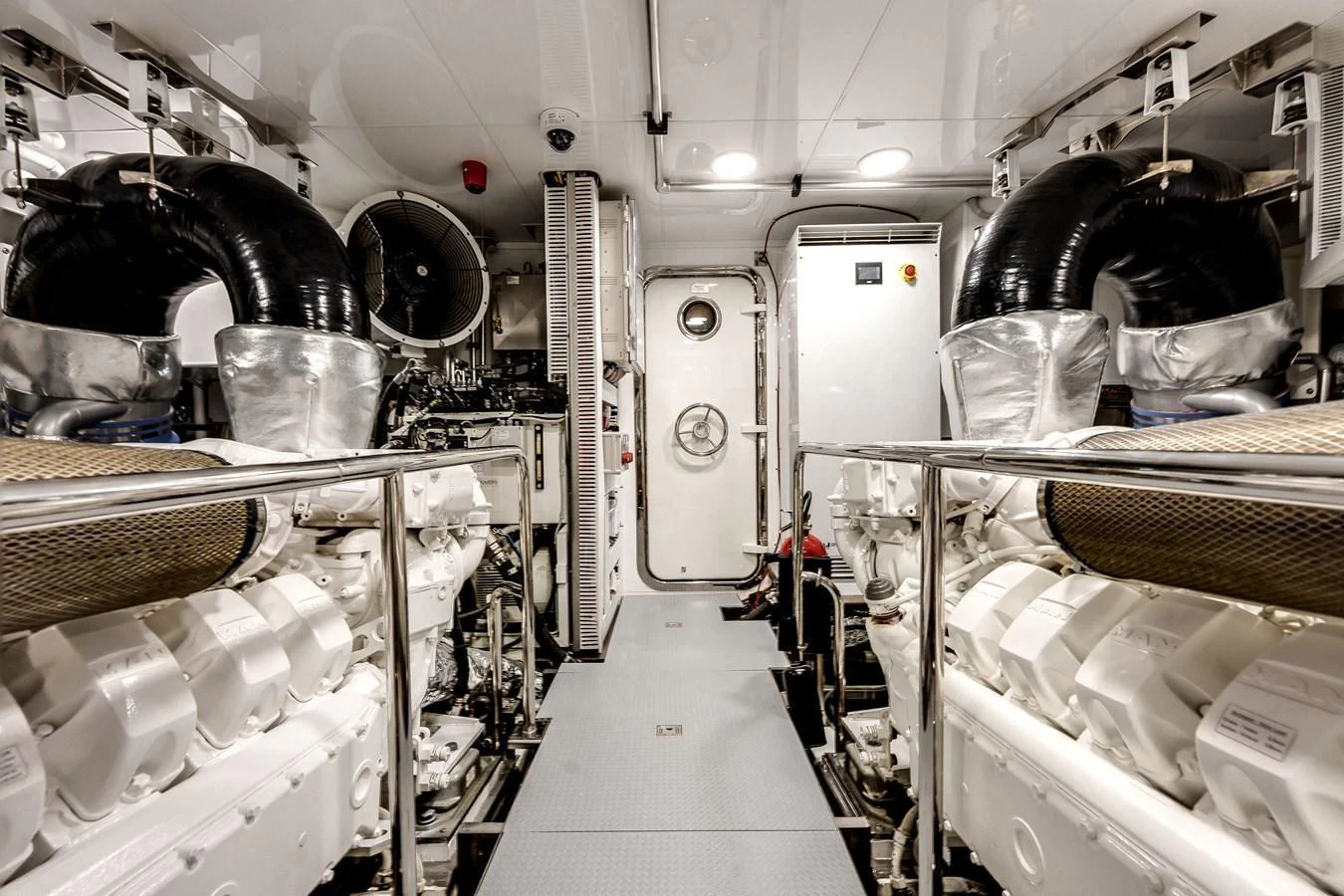 The engine room showcases the yacht's powerful and meticulously maintained machinery. aboard CHAOS Yacht for Sale