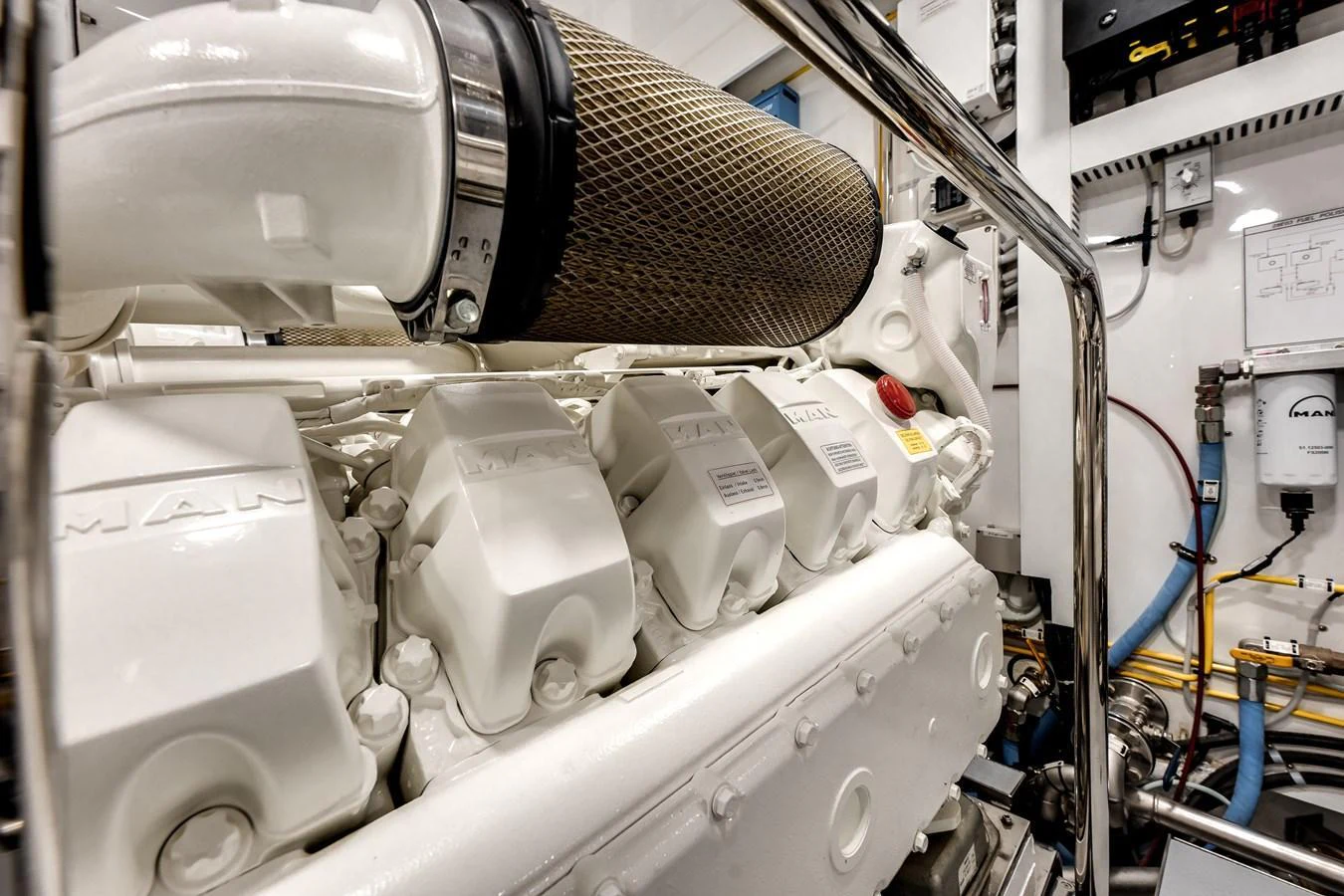 A close-up view of the yacht's powerful engine room showcasing its mechanical precision. aboard CHAOS Yacht for Sale