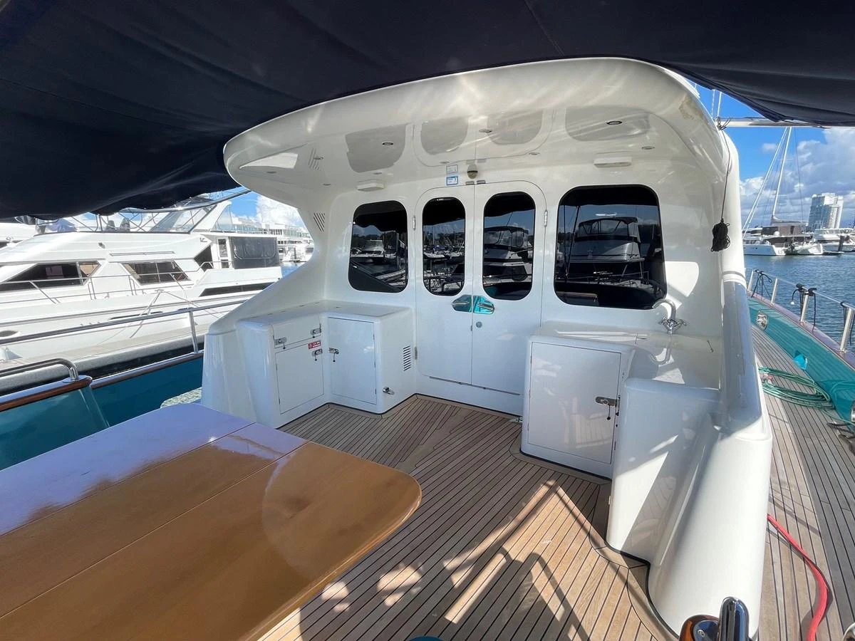 The aft deck offers a spacious and shaded area for relaxation and socializing. aboard SV TEAL Yacht for Sale