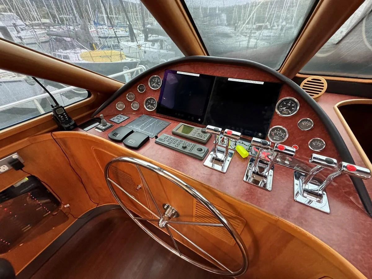 The helm station features a sophisticated control panel with multiple gauges and navigation screens. aboard SV TEAL Yacht for Sale