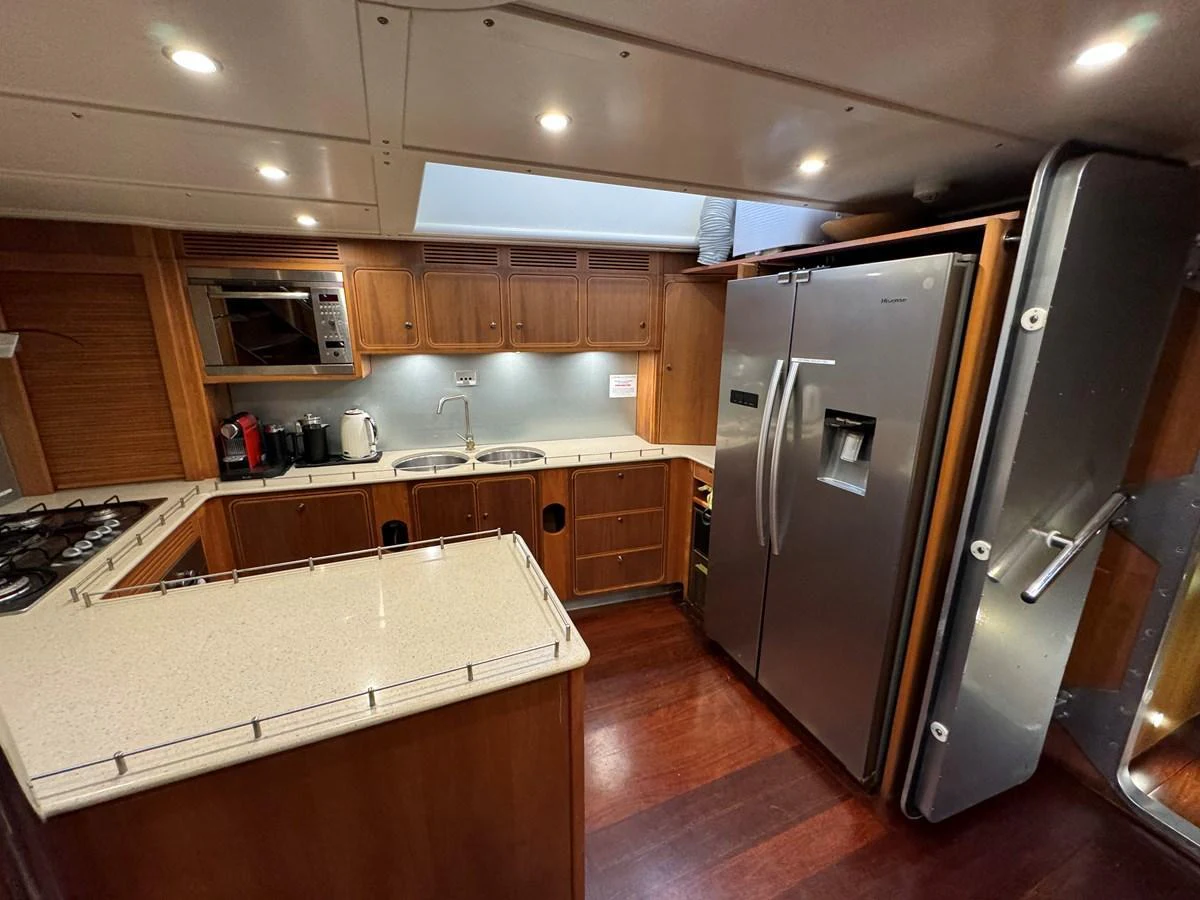 The yacht's galley features modern appliances and a spacious countertop for meal preparation. aboard SV TEAL Yacht for Sale