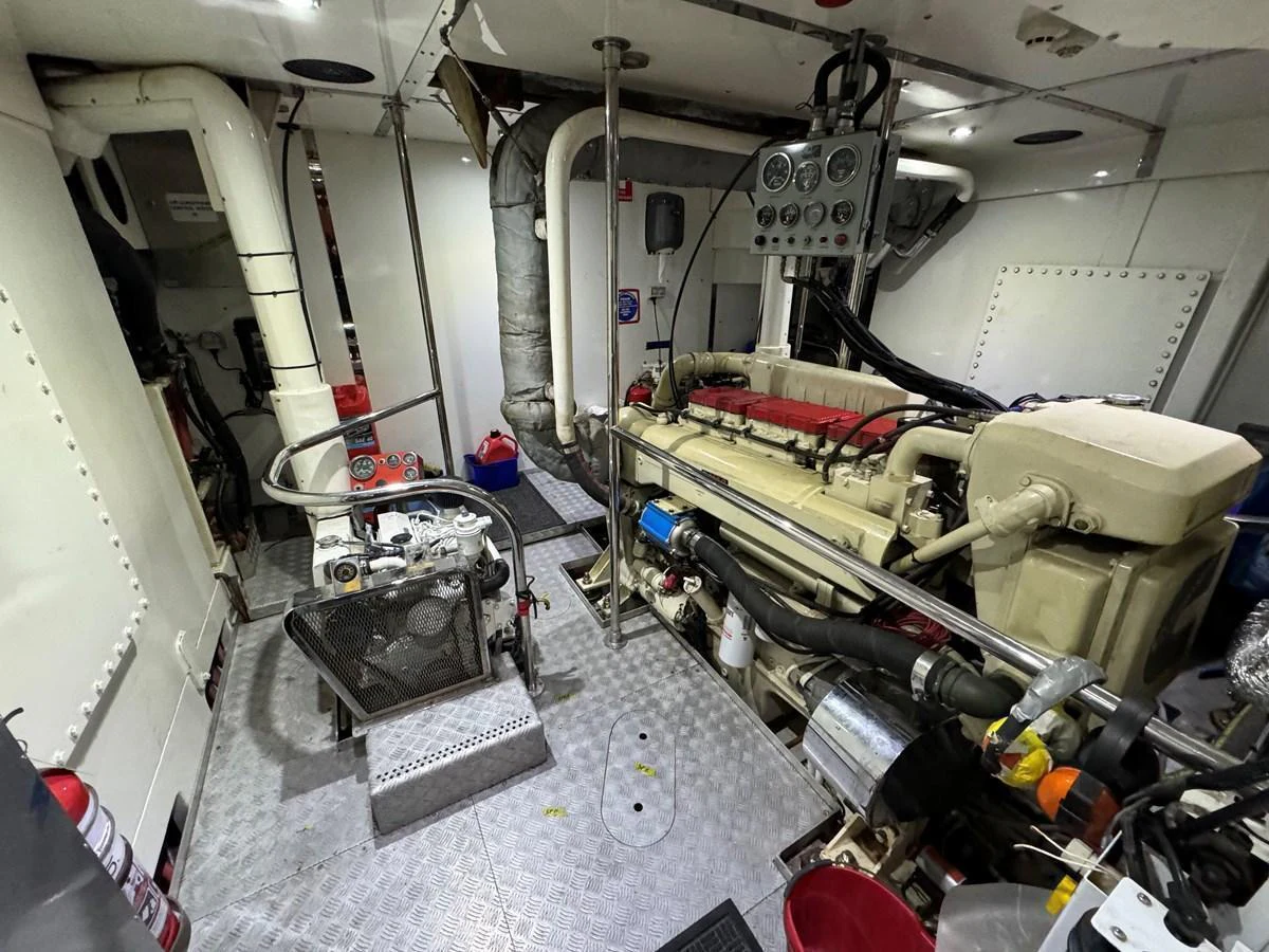 The image showcases the yacht's well-maintained engine room with visible machinery and equipment. aboard SV TEAL Yacht for Sale