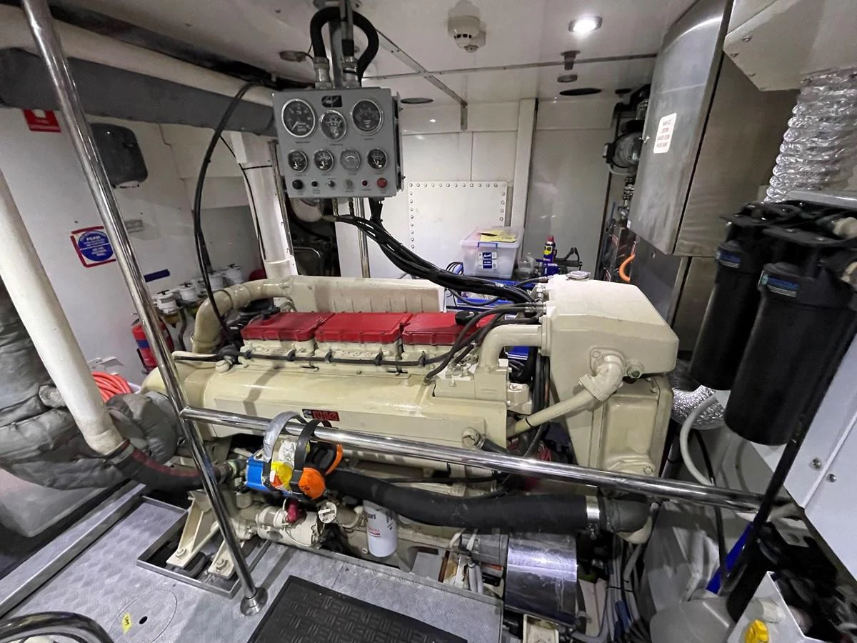 The image showcases the well-maintained engine room of the yacht, highlighting its mechanical components. aboard SV TEAL Yacht for Sale