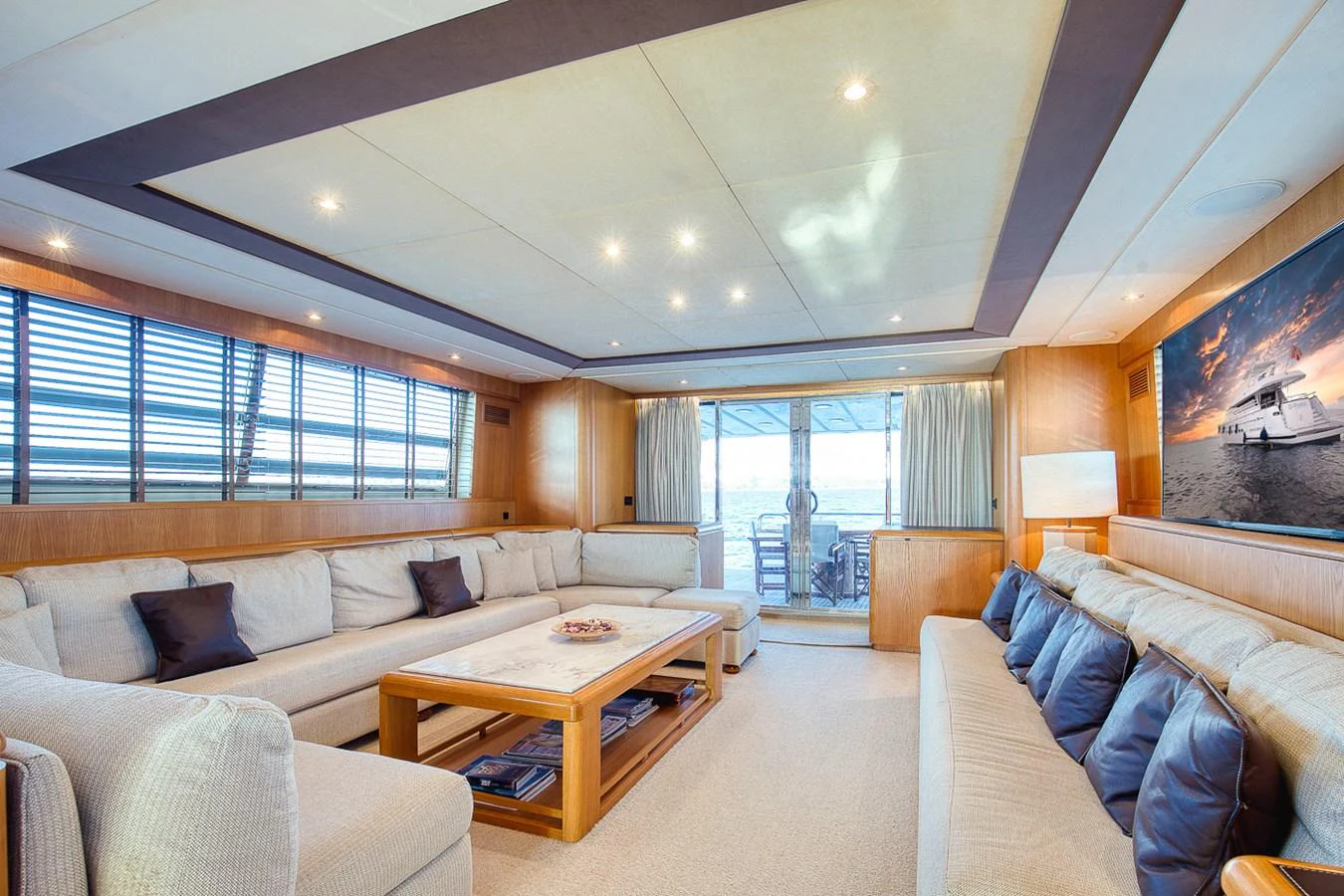 The spacious salon features comfortable seating, elegant lighting, and large windows for natural light. aboard D-FORCE Yacht for Sale