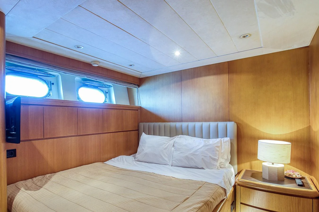 A cozy stateroom with a comfortable bed and soft lighting. aboard D-FORCE Yacht for Sale