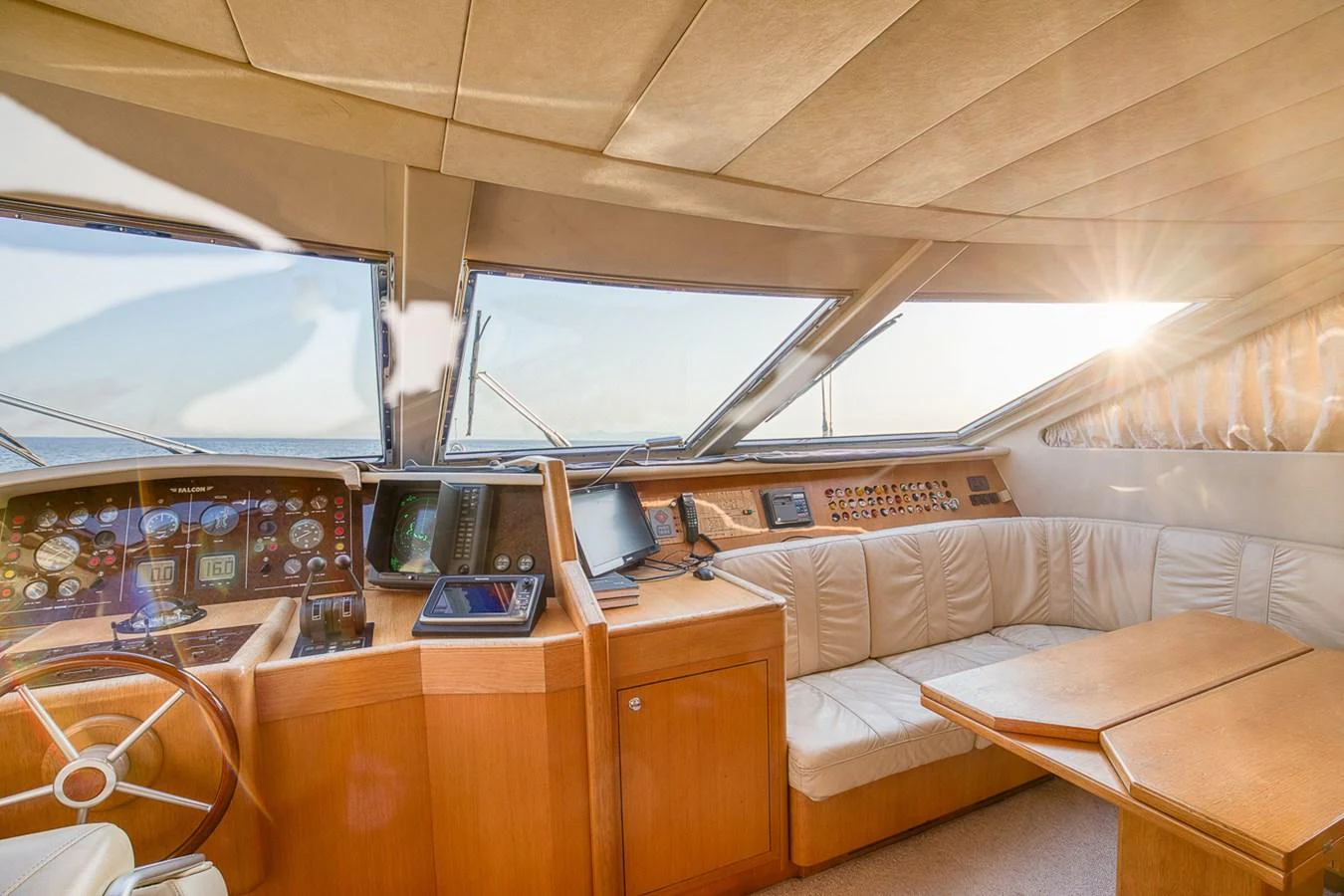 The helm area features a luxurious and well-equipped control station with ample seating and panoramic windows. aboard D-FORCE Yacht for Sale