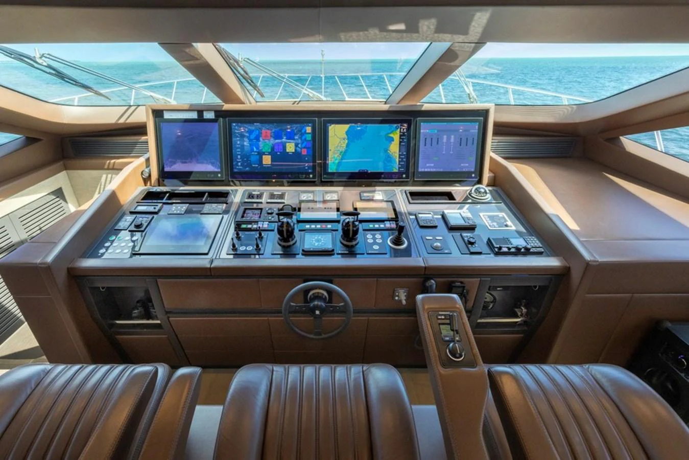 The helm station features advanced navigation equipment and luxurious leather seating. aboard SAYONARA Yacht for Sale