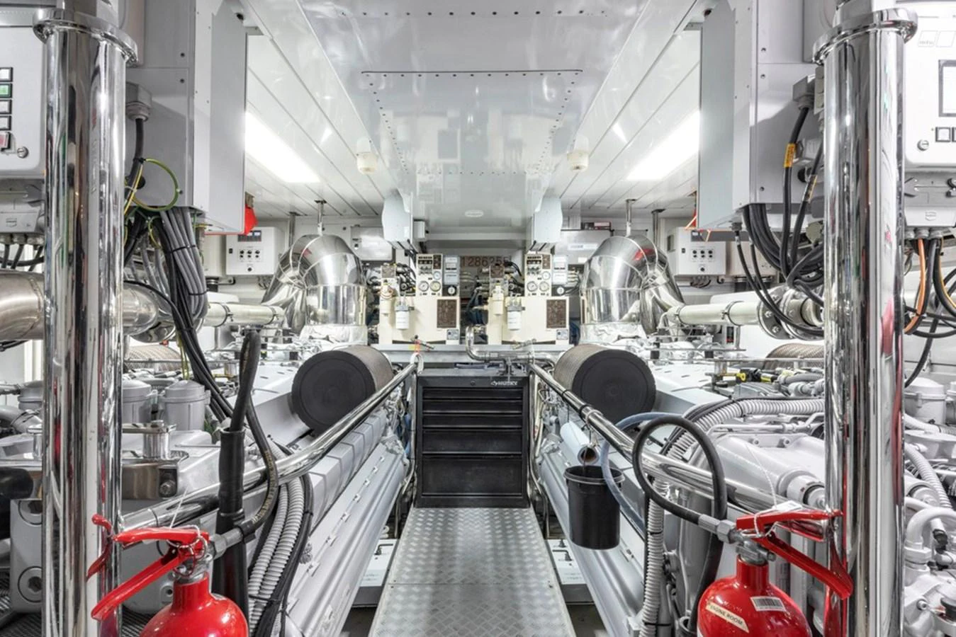 The yacht's engine room showcases advanced machinery and meticulous organization. aboard SAYONARA Yacht for Sale