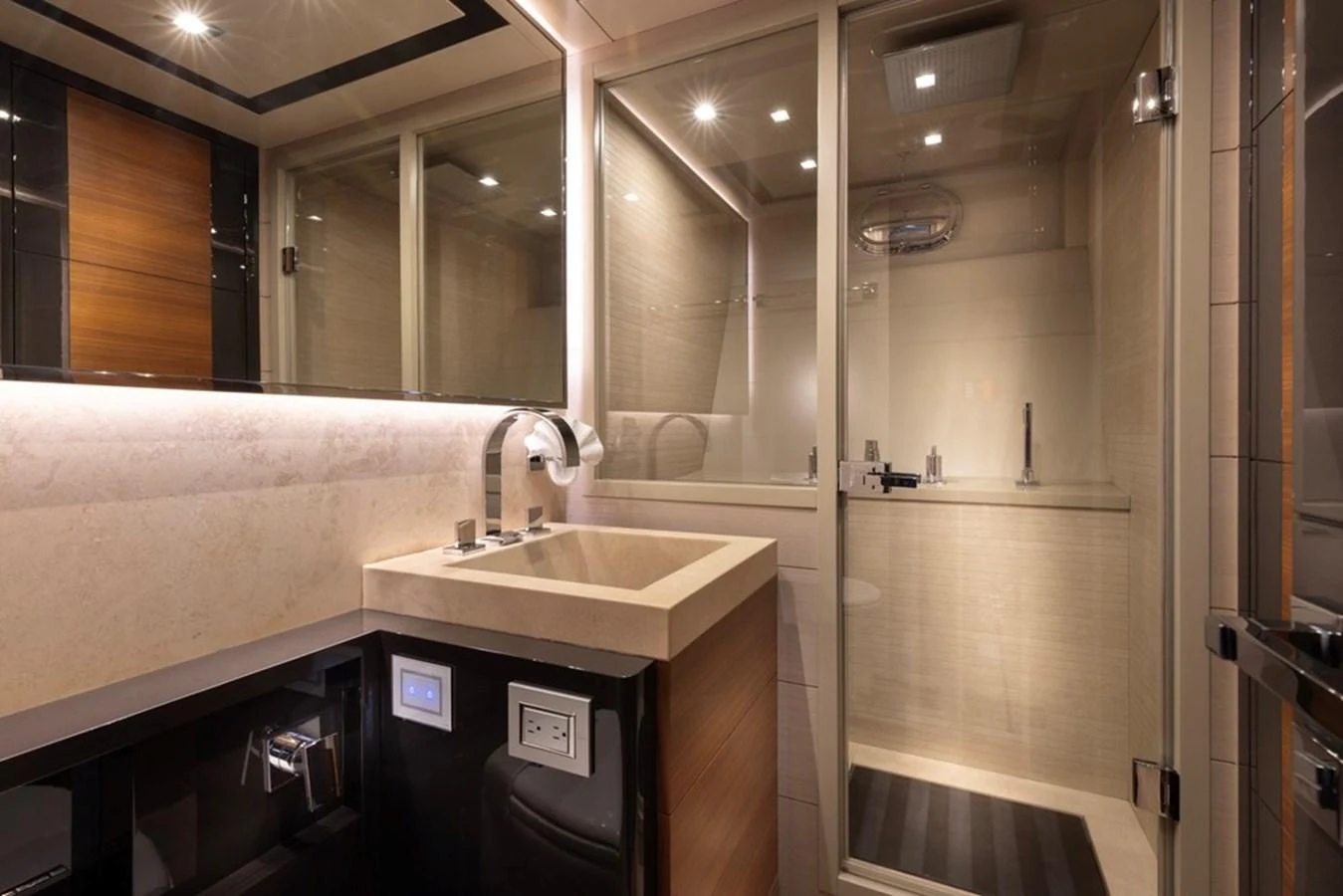 The yacht's bathroom features a modern design with a spacious shower and elegant fixtures. aboard SAYONARA Yacht for Sale