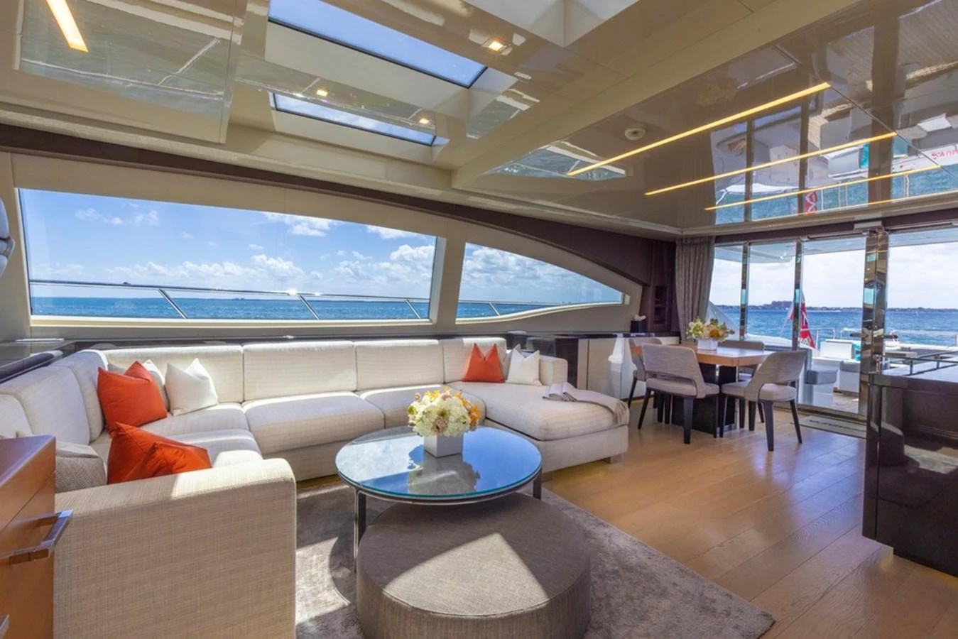 The salon offers a spacious and luxurious seating area with panoramic ocean views. aboard SAYONARA Yacht for Sale