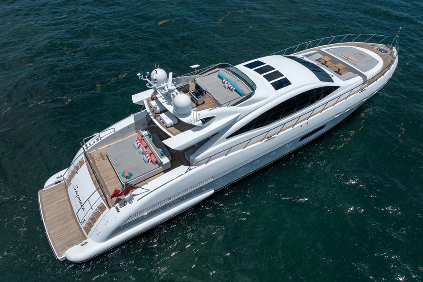 A sleek and modern yacht cruising on the open water, showcasing its luxurious design and spacious decks. aboard SAYONARA Yacht for Sale