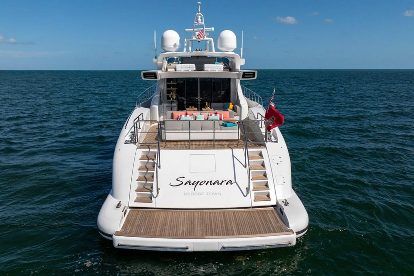 The yacht's aft deck features a spacious lounging area with comfortable seating, perfect for relaxation and entertaining. aboard SAYONARA Yacht for Sale