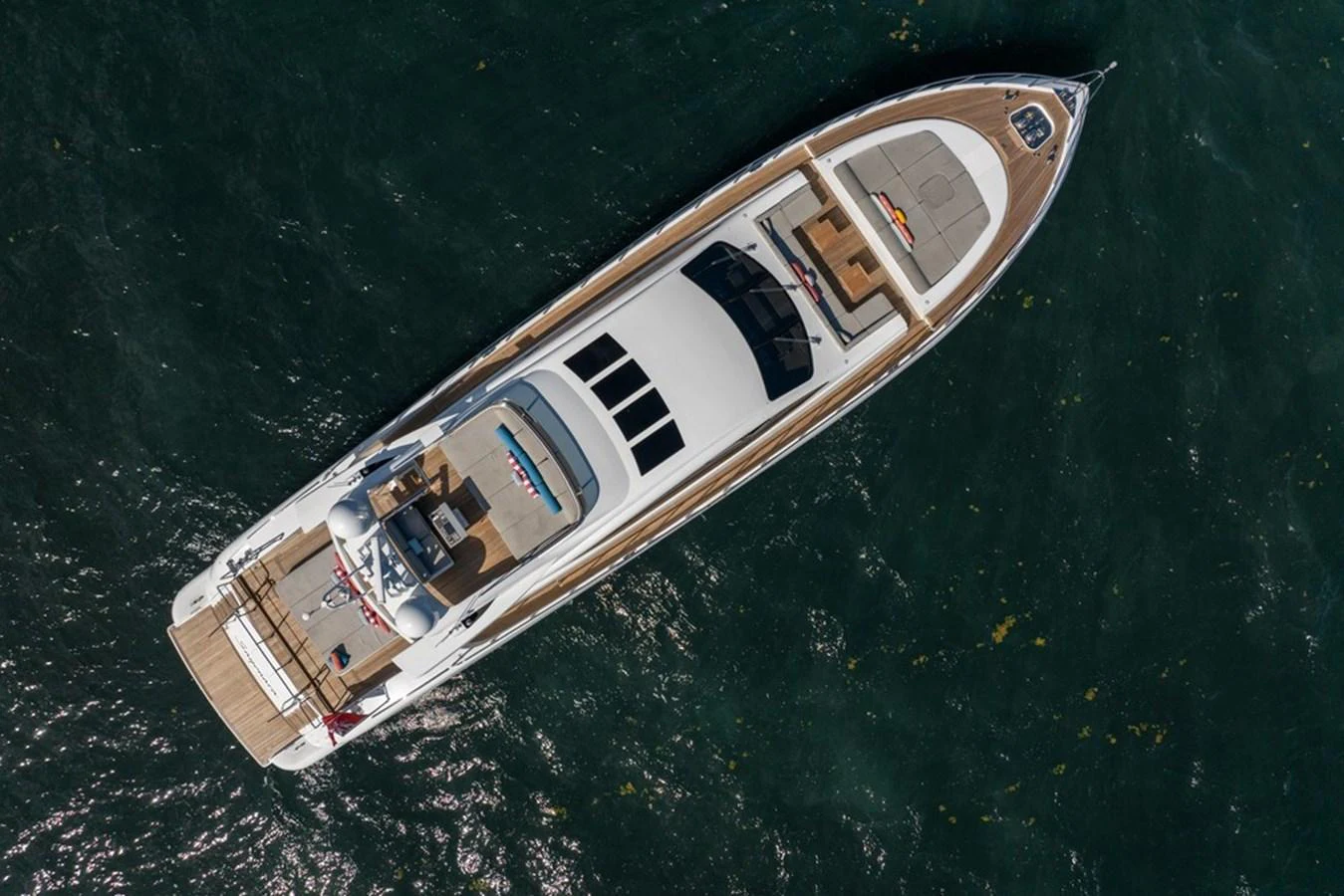 An aerial view of a sleek and modern yacht cruising through the water. aboard SAYONARA Yacht for Sale