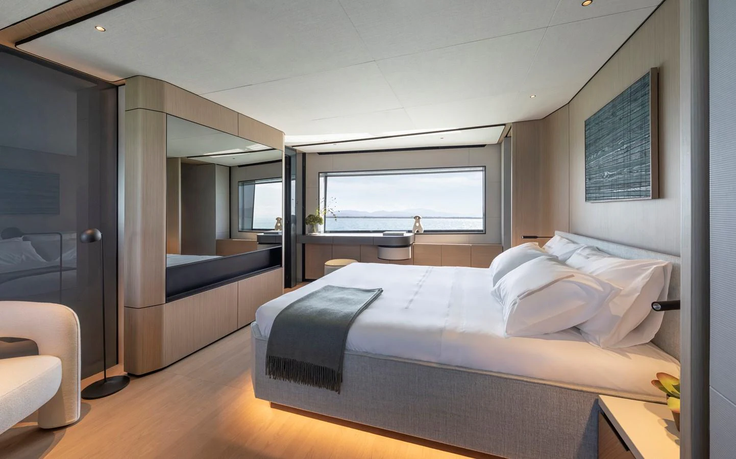 The master stateroom features a spacious bed with elegant decor and a large window offering stunning sea views. aboard AZIMUT GRANDE 30M NEW Yacht for Sale
