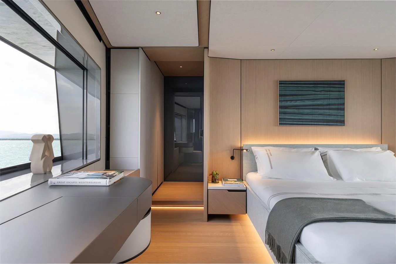 A luxurious stateroom with a modern design and large windows offering a serene view. aboard AZIMUT GRANDE 30M NEW Yacht for Sale