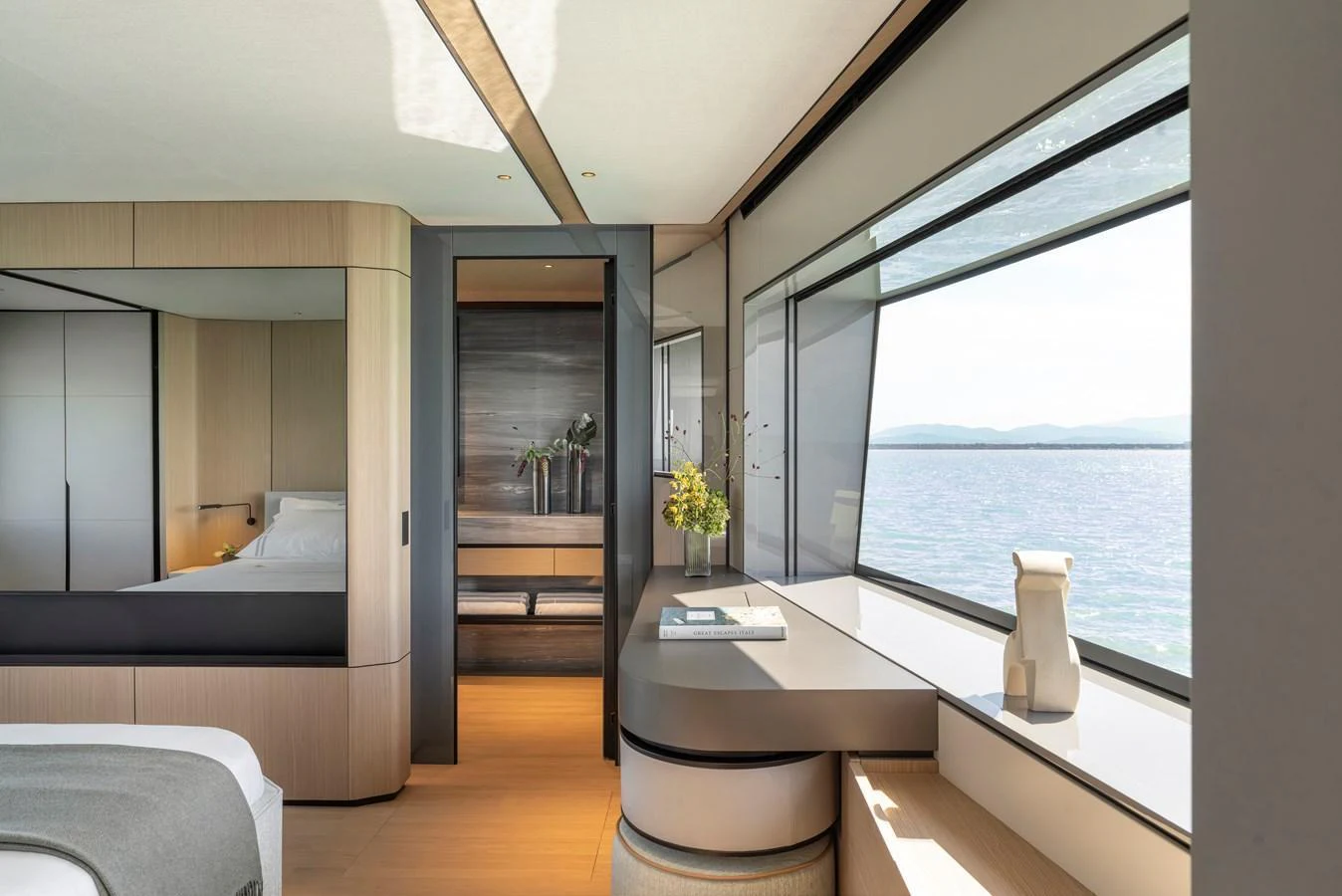 The stateroom offers a serene and luxurious space with expansive windows providing stunning ocean views. aboard AZIMUT GRANDE 30M NEW Yacht for Sale
