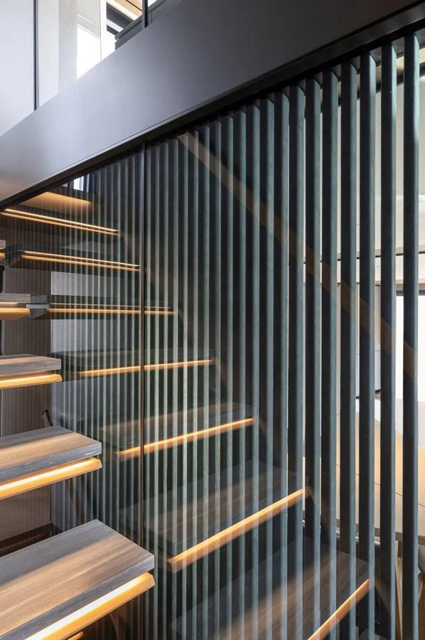 A modern staircase with sleek lines and integrated lighting enhances the yacht's interior elegance. aboard AZIMUT GRANDE 30M NEW Yacht for Sale