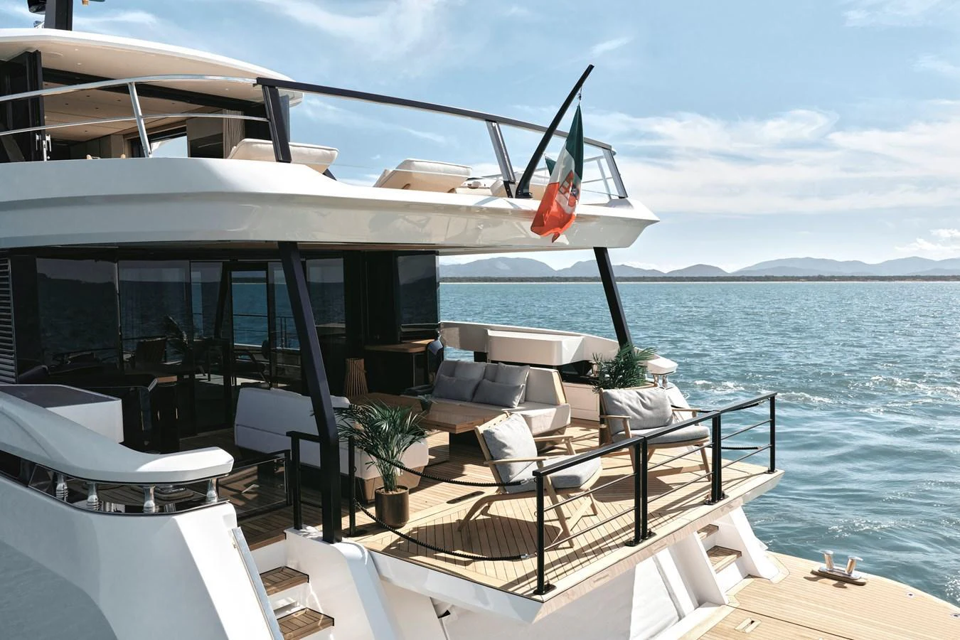 The aft deck of this yacht offers a luxurious outdoor lounging area with stunning views of the water. aboard AZIMUT GRANDE 30M NEW Yacht for Sale