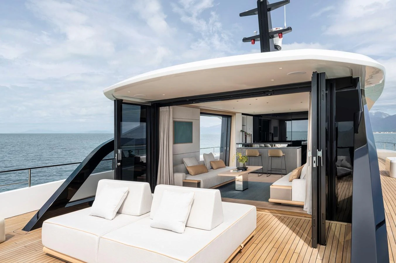 The aft deck features luxurious lounging areas with a seamless transition to the interior living space. aboard AZIMUT GRANDE 30M NEW Yacht for Sale