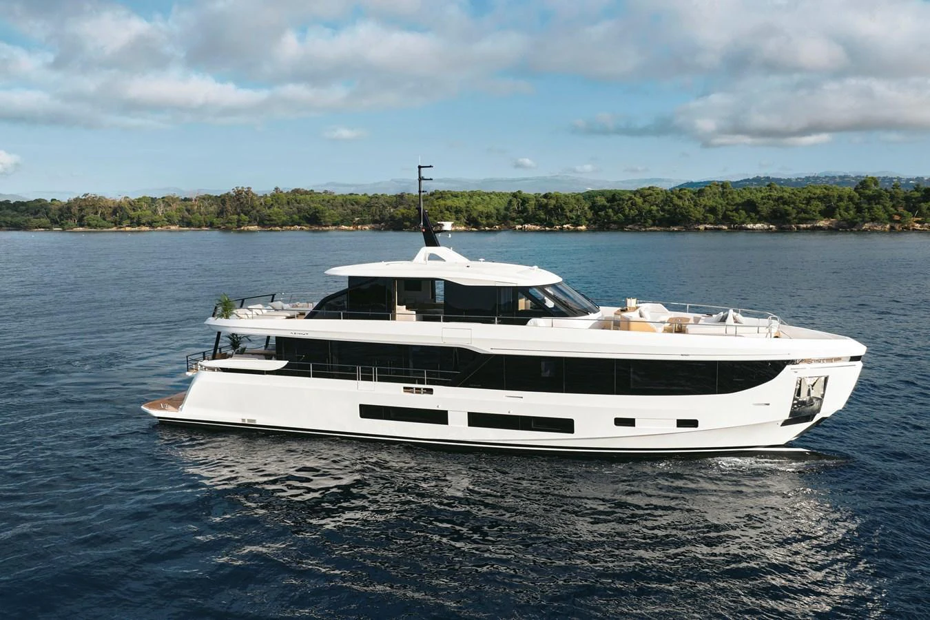 A sleek and modern yacht cruising on calm waters under a partly cloudy sky. aboard AZIMUT GRANDE 30M NEW Yacht for Sale