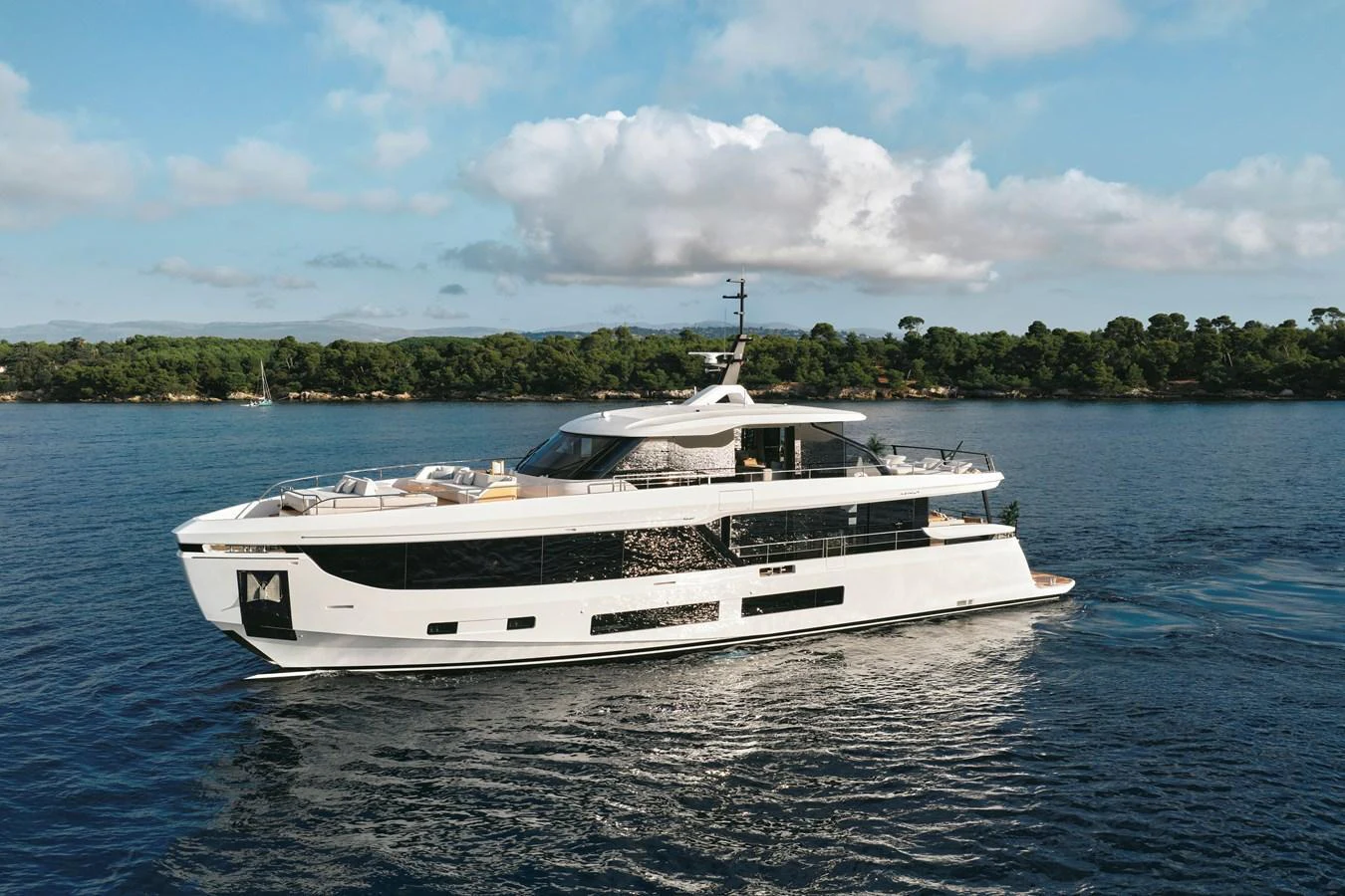 A sleek and modern yacht cruises gracefully on calm waters under a clear sky. aboard AZIMUT GRANDE 30M NEW Yacht for Sale