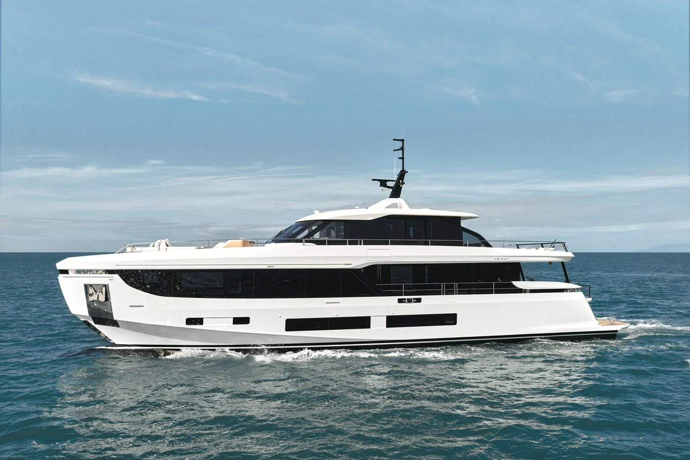 A sleek and modern yacht glides gracefully across the calm blue waters. aboard AZIMUT GRANDE 30M NEW Yacht for Sale