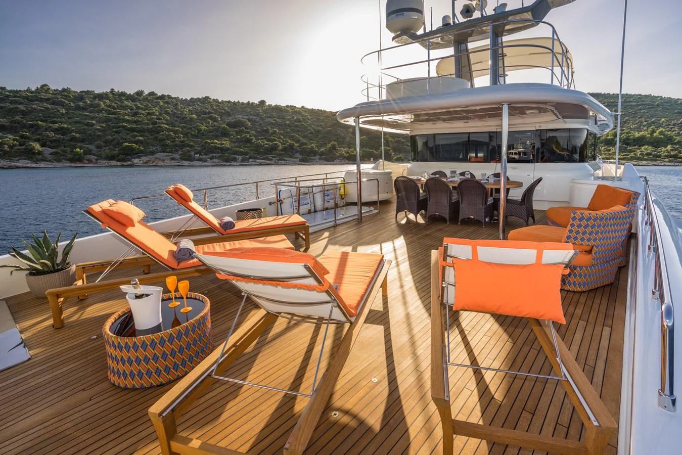 The sundeck offers a luxurious space with sun loungers and a dining area, perfect for relaxation and entertainment. aboard SEVENTH SENSE Yacht for Sale