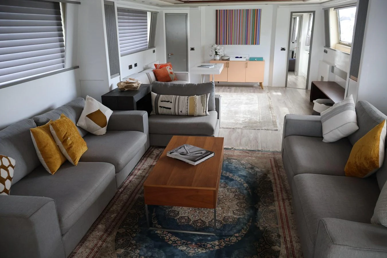 The yacht's salon features comfortable seating with modern decor and ample natural light. aboard Q Yacht for Sale