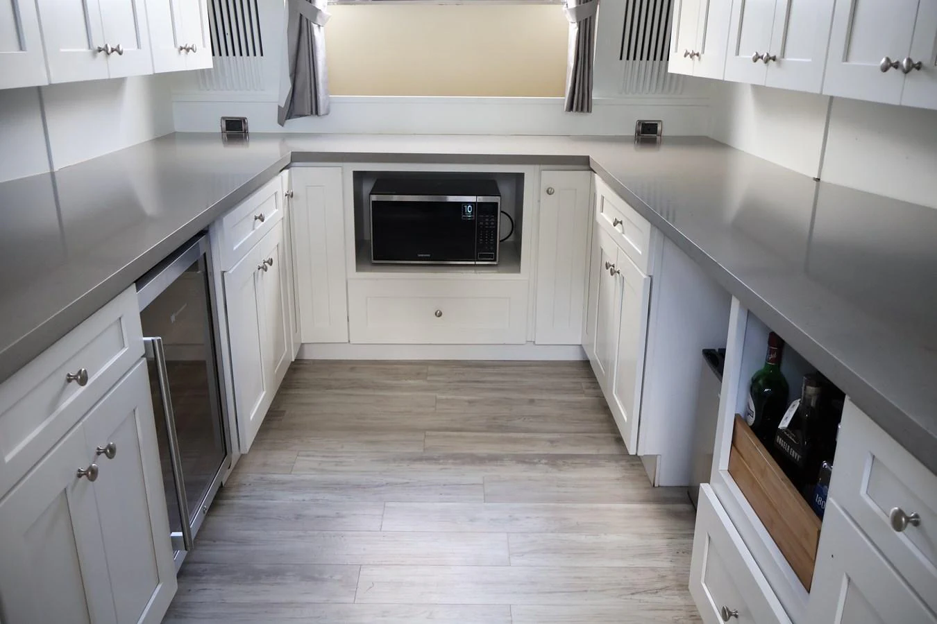 The yacht's galley features modern appliances and ample counter space, perfect for culinary endeavors at sea. aboard Q Yacht for Sale