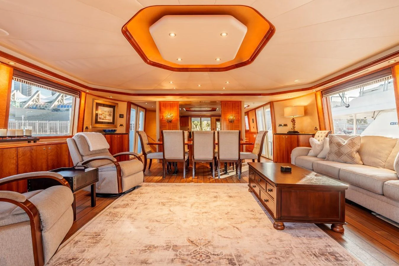 The yacht's salon features elegant furnishings and ample seating, creating a warm and inviting atmosphere. aboard SNOWBORED Yacht for Sale