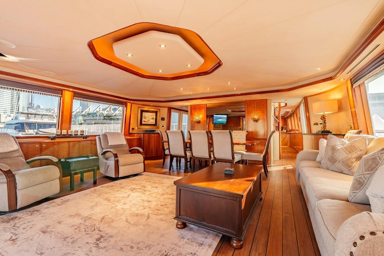 The spacious salon features elegant furnishings and ample seating, creating a luxurious and inviting atmosphere. aboard SNOWBORED Yacht for Sale