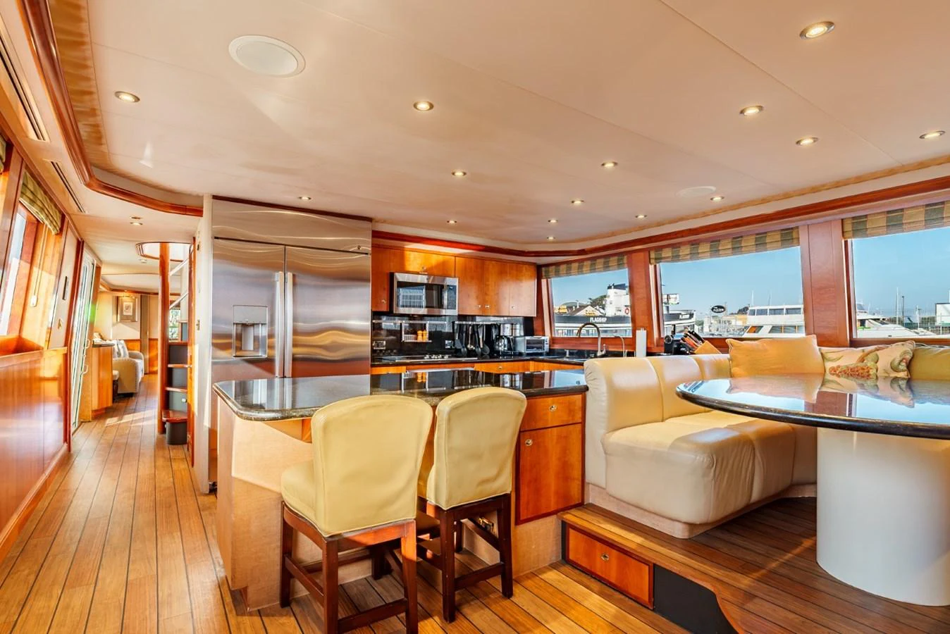 The yacht's galley features a spacious and well-lit area with modern appliances and comfortable seating. aboard SNOWBORED Yacht for Sale